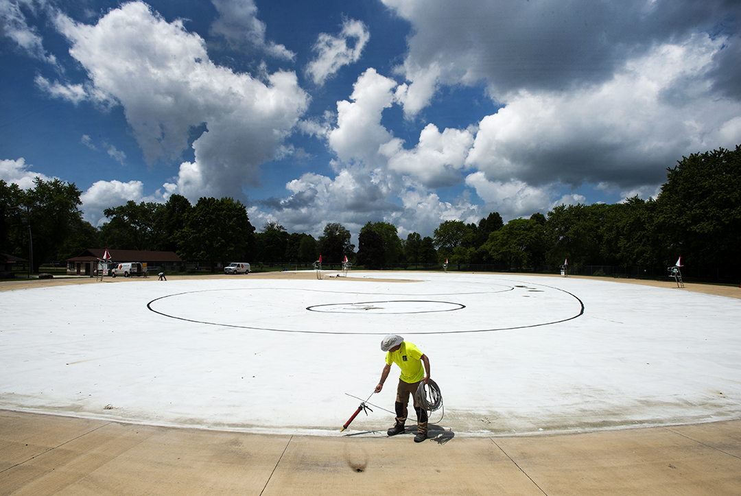 Shaun Dugan does maintenance on the Kiwanis Park pool in Kitchener. The pool is scheduled to open Saturday, June 22.