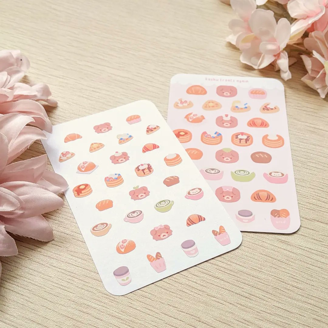 embubuu's tweet photo. Some sticker sheet prototypes I've been working on! 🍓 These are teeny tiny (3x5 inches) as I've been playing around with the sheet ratios and such! Still, it's fun drawing yummy stuff ☕🍞❤️ https://t.co/RSvApj10U8