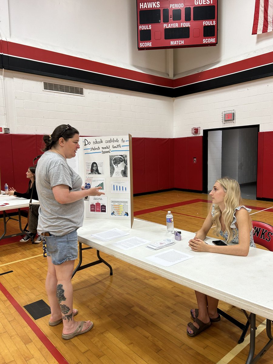 Bella showing her research into schools contributions to students mental health issues #sealofcivicreadinessnight2024 📚🇺🇸