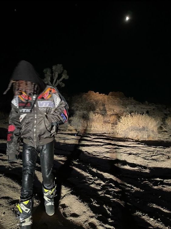Destroy lonely in Vetements racing bomber jacket and motorsport