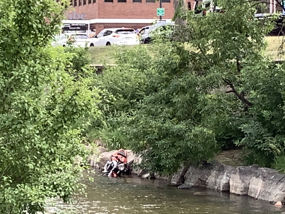 ddchen's tweet photo. We’ve had many cars dropping into the river, but this is the first time I’ve seen a motorcycle do it. The rider was guffawing with the police, so presumably he passed his sobriety test. #BikeDen https://t.co/GONkU40dgK