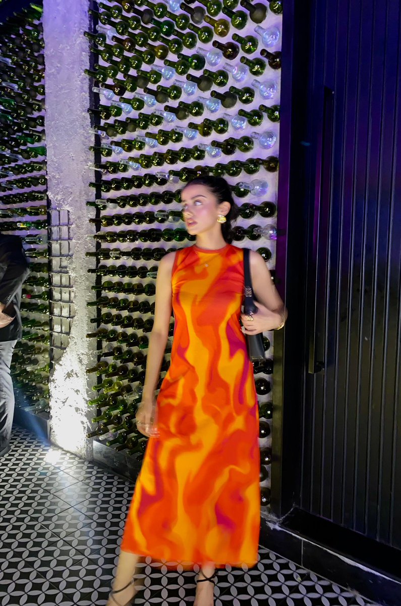 shopaaria's tweet photo. our orange dress is literally matching the heat levels on the weather app https://t.co/vsKR67mPVa