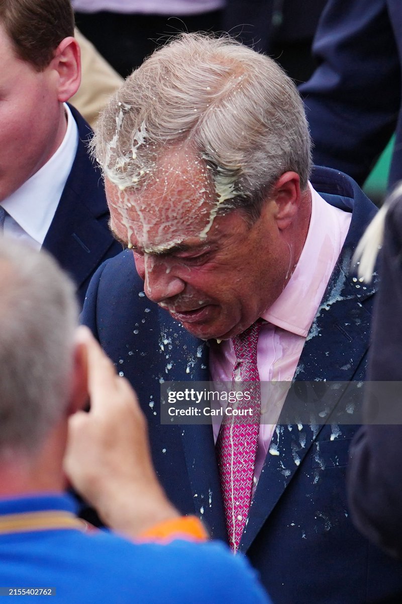 shitbritishpics's tweet photo. Reform UK party leader Nigel Farage reacts after a woman threw a drink over him, as he launches his election candidacy at Clacton Pier (2024) https://t.co/Pnm4zsmixS