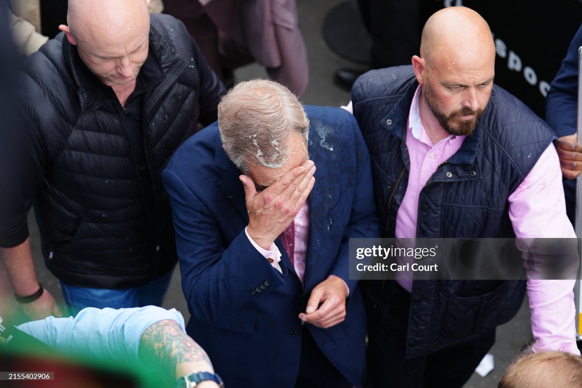 shitbritishpics's tweet photo. Reform UK party leader Nigel Farage reacts after a woman threw a drink over him, as he launches his election candidacy at Clacton Pier (2024) https://t.co/Pnm4zsmixS