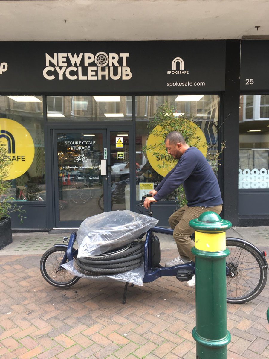 Our new e-cargo bike will shortly be available for hire from <a href="/SpokeSafe/">Spokesafe</a> in Newport - our test run yesterday caused quite a stir, and it coped with Newport's infamous hills easily with Luis as the cargo ! Let's reduce pollution in our city centre by moving stuff around by bike.