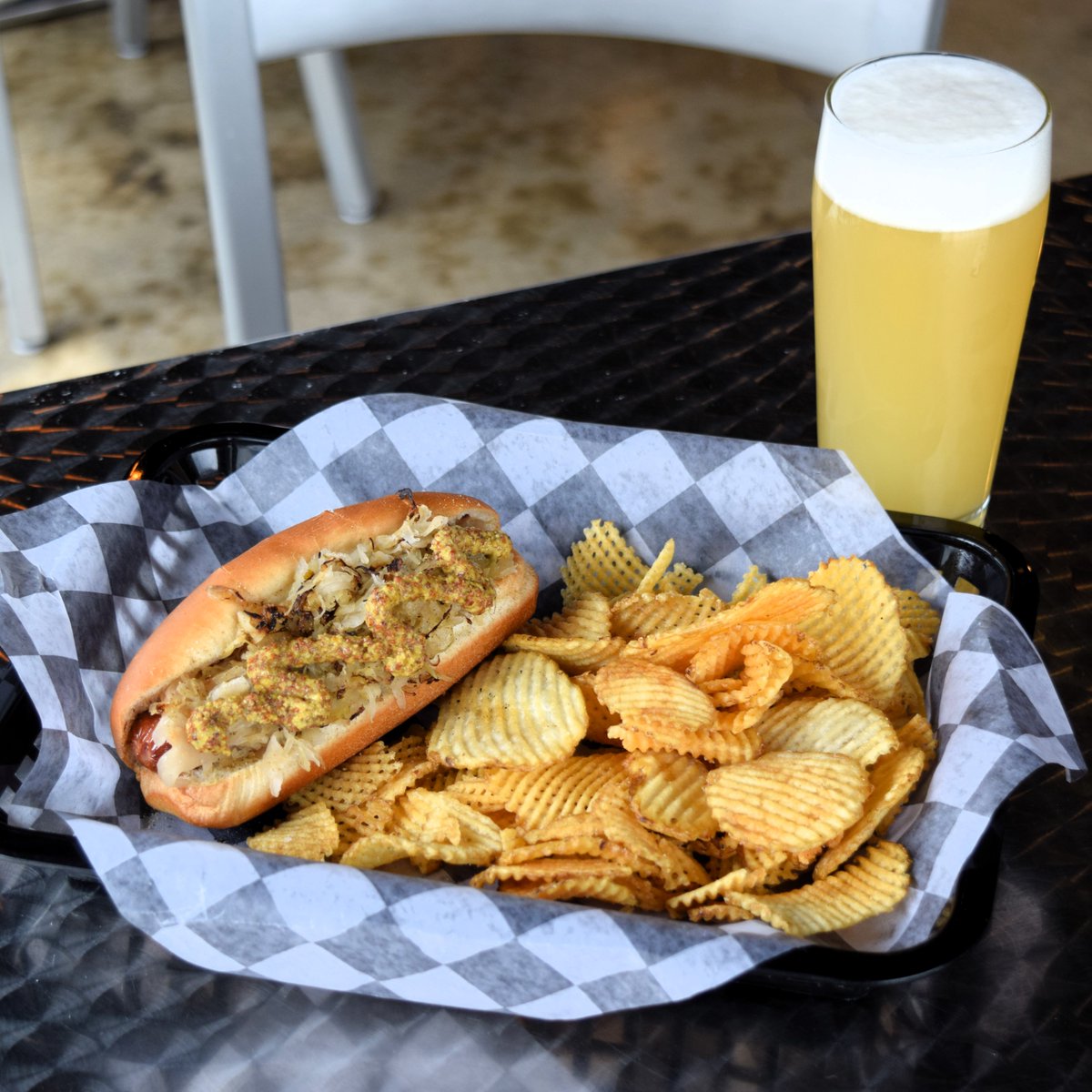 Hot dog summer has officially kicked off and we're leading it off with the Mad Dog.  An all beef dog topped with celery salt, kraut, and stone ground mustard served on a toasted bun.  We'll be posting more delicious summer menu pictures throughout the week. Cheers!🌭🍻😋