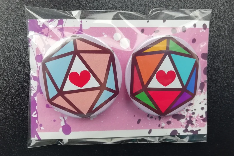 azuworks's tweet photo. It's PRIDE month, so my queer ass gets to show off some TTRPG and FFXIV queer goods from my Etsy store.
Help a gay out and check out my store! (Link Below) https://t.co/jHvehJQKM1