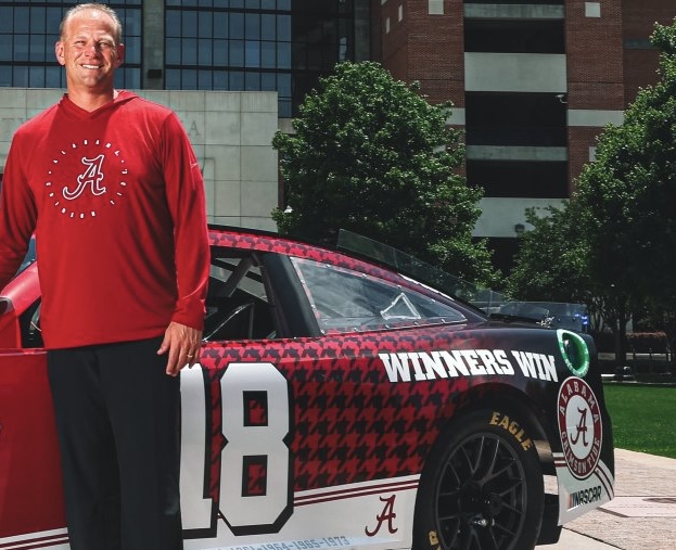 RyanCFowler's tweet photo. Alabama showing off its partnership with NASCAR, Kalen DeBoer with the car out in front of Bryant-Denny Stadium.

I like the car featuring the old-school logo, which is my favorite Alabama logo. I also noticed they have added one of @KalenDeBoer 's favorite quotes. Winner Win which comes from his college coach, Bob Young at Sioux Falls.

“Winners win because that’s what winners do.” - Kalen DeBoer

DeBoer uses this quote with his team. He learned it from his legendary college head coach, Bob Young, at Sioux Falls.

What do you think about the new @NASCAR vehicle featuring many of the Crimson Tide logos?

Photo Credit: UA Athletics