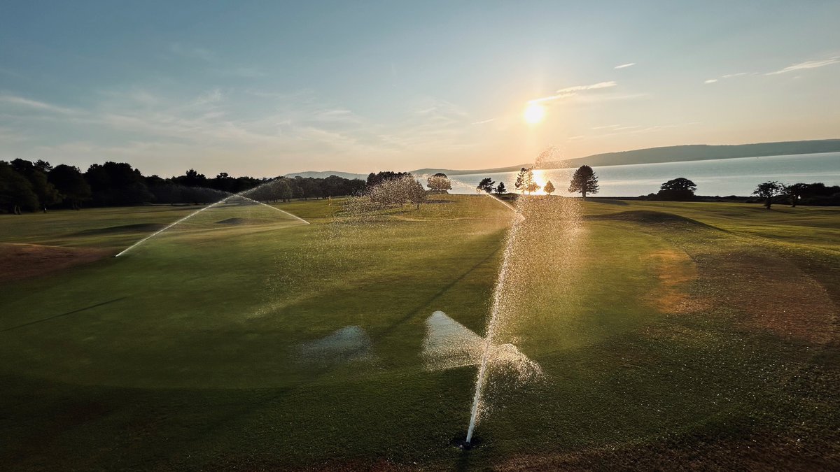 Watering the 14th green at Royal Belfast just before sunset... #oldestgolfclubinireland #gettheroyaltreatment #golf #sunset