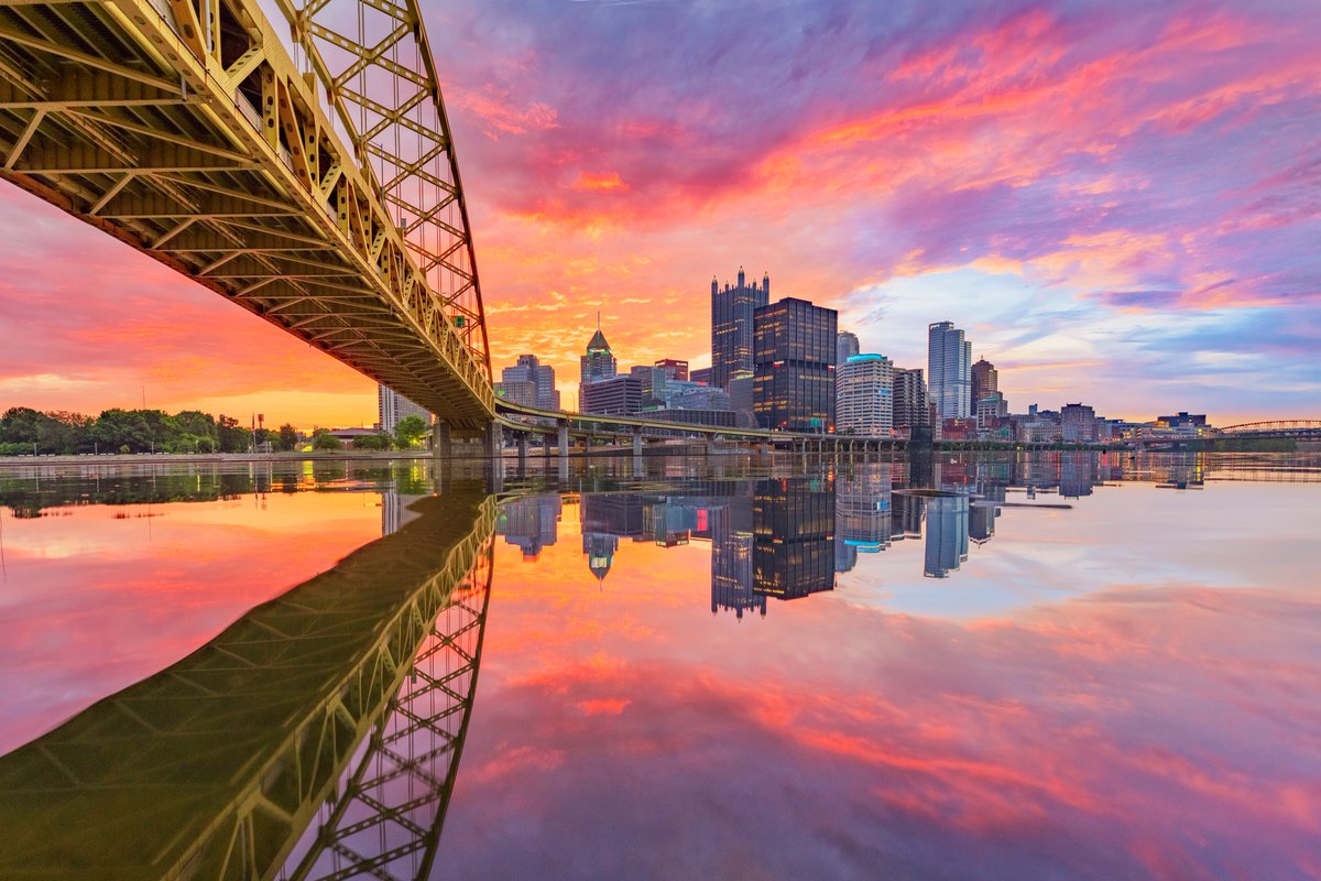 What a sunrise in #Pittsburgh this morning. While the middle of the Monongahela River was choppy, the part right next to the shore under the Ft. Pitt Bridge was like a mirror, which made for the perfect perspective of the vibrant color.