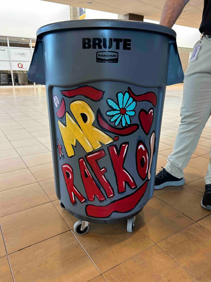 AP Rafko can be found daily rolling a trash bin to help keep the lunchroom clean. On the last day of lunches, the Art Department (commissioned by some of our maintenance staff) provided him his own 😊