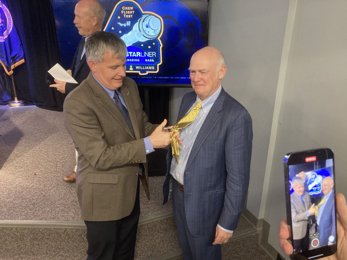 jeff_foust's tweet photo. Steve Stich cuts Tory Bruno’s tie after the post-launch press conference to mark ULA’s entry into the “human spaceflight club.” https://t.co/6TmPUvLXMj