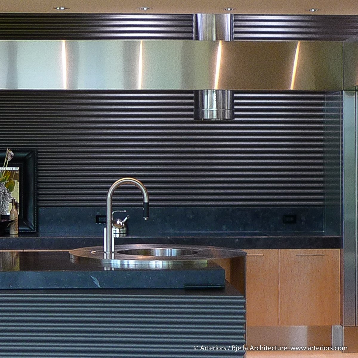 House_Architect's tweet photo. A modern kitchen with custom corrugated wood backsplash and bird's-eye maple cabinets https://t.co/pFHKjVRuZs