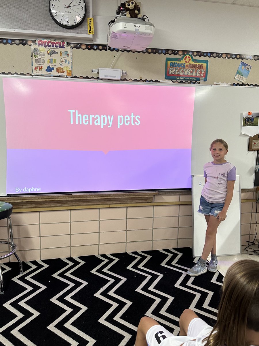 Daphne presenting her passion project on therapy pets. #engaged64