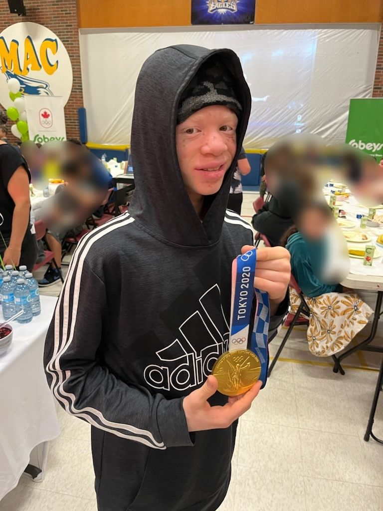 How many of us have the chance to hold an Olympic Gold Medal?
Feel the weight of it?
Run your fingers over the surface of it?

You're a true gentleman, Mr. Warner. Thank-you for your kindness and taking the time to make sure my students got everything they could from your visit.