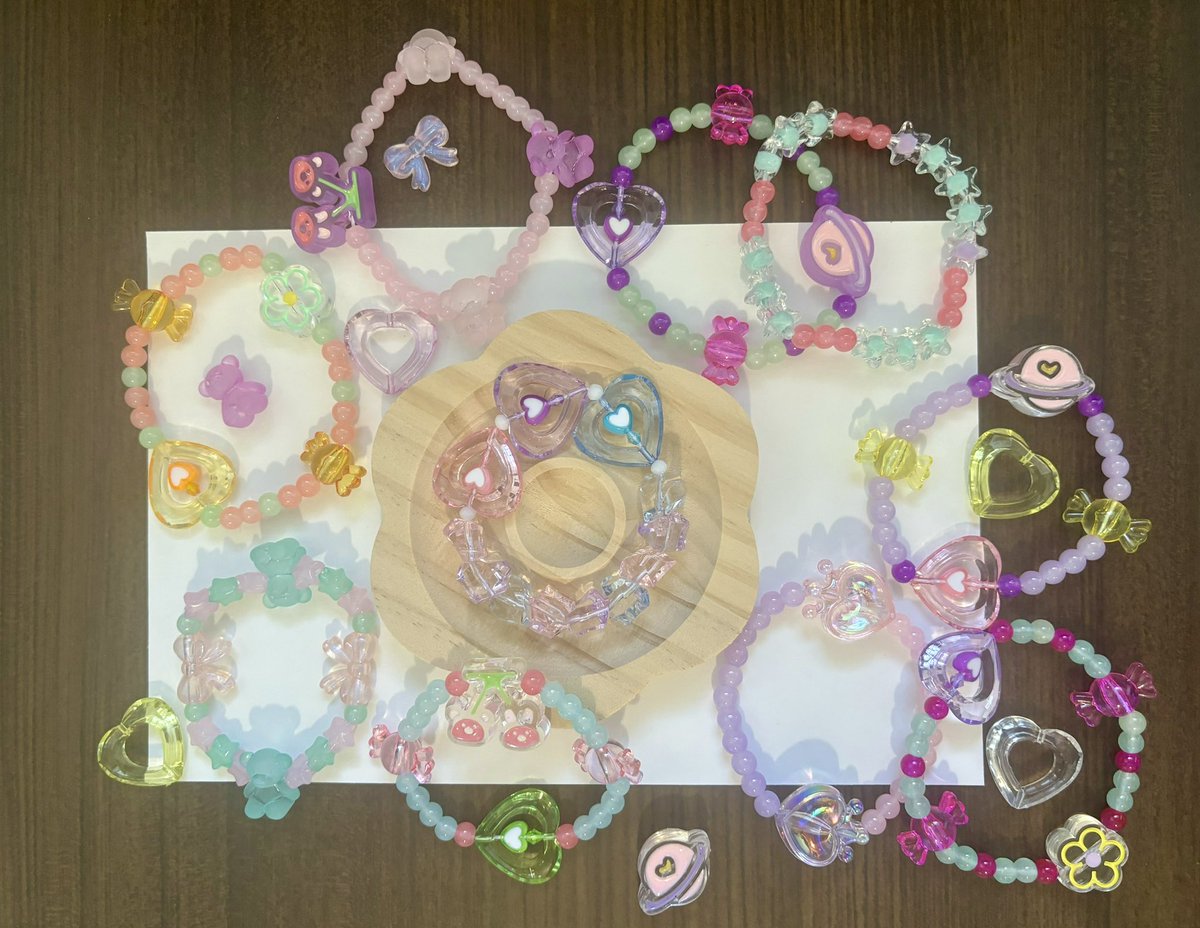StarryPochette's tweet photo. Also! Any orders placed during this weekend will get a free stretchy friendship bracelet if you include a note with your order that tells me the size of your wrist (inches) and a main color. 🫡

These are some examples of bracelets I’ve made: https://t.co/He9HUtsaVJ