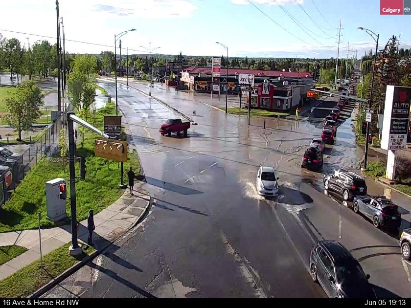 yyctransport's tweet photo. ALERT: Hazardous Road Condition on 16 Ave and Home Rd NW, the road is closed westbound. Water flooding in the area.. https://t.co/uTypbffDxp
