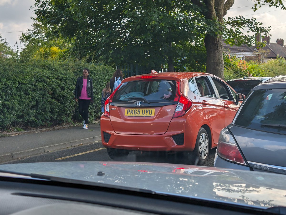 Mechanic_Jon's tweet photo. Gotta love a phone user on a school run with kids in the car outside a school with kids everywhere. She drove off like this. Didn't care that I said something.  I was parked. https://t.co/E52VprUcBc