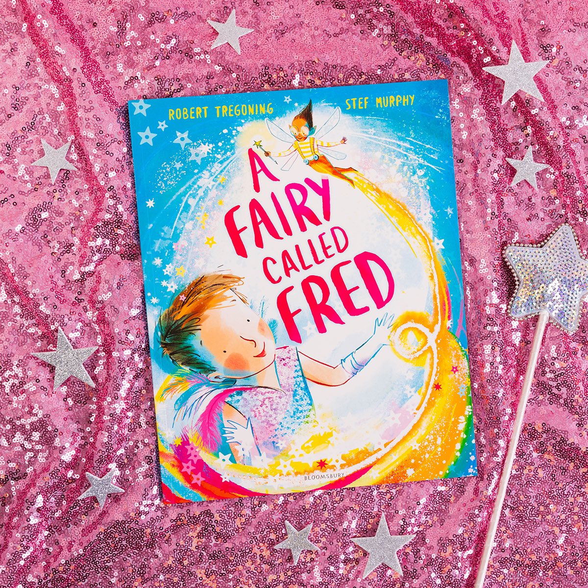 A Fairy Called Fred by <a href="/bobtregoning/">Robert Tregoning 🌈</a> and illustrated by <a href="/StefMurphyArt/">Stef Murphy</a> 🌈

A funny, joyful Cinderella story that celebrates the courage it takes to be yourself. From the creators of the much-loved picture book Out of the Blue.