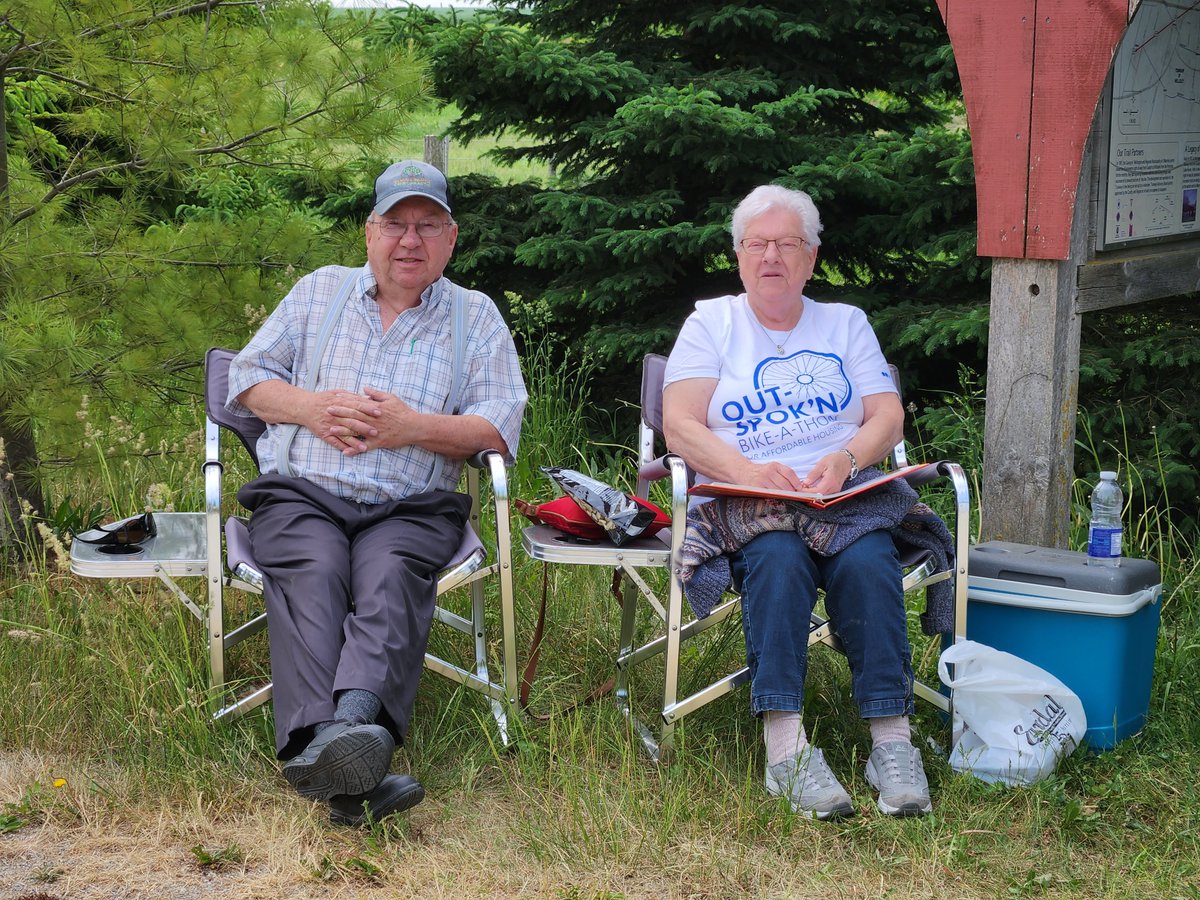 Our bike-a-thon could not happen without the tremendous support of volunteers like Charlie and Irene. Always happy to greet participants at the end of the trail with some cold water and a big smile. More details about the event can be found here: canadahelps.org/.../Out-SpoknX…