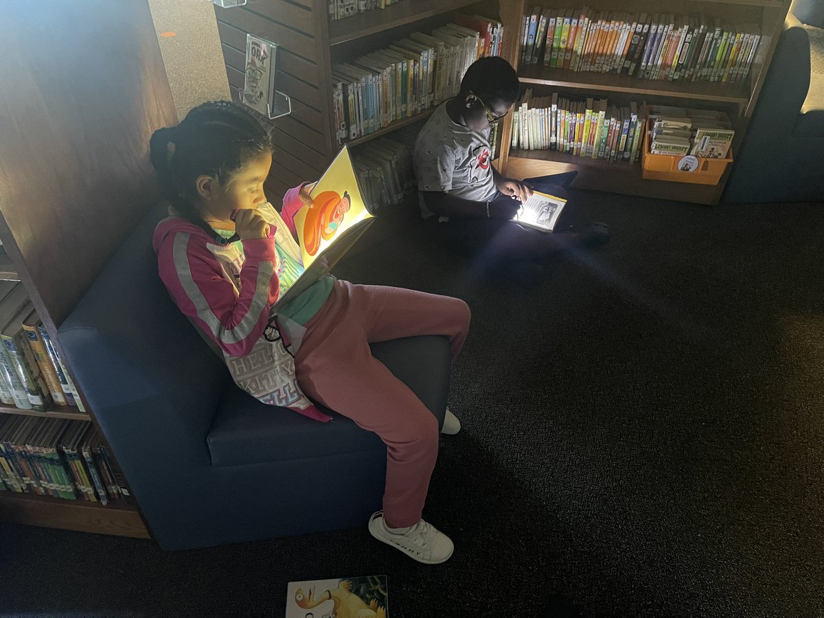 MrsMWise's tweet photo. These Roadrunners and Sharks are celebrating Camp Read A-Lot with some flashlight reading in the library! #lpssummer2024 https://t.co/tJiKrn5pjZ
