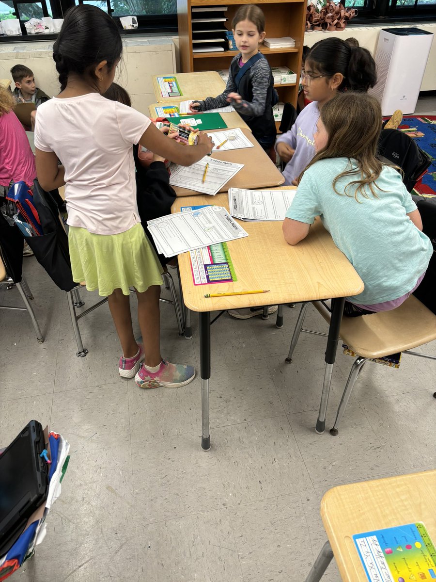 Students enjoying working in groups on their pizza restaurant project. Students are seeing how math can be applied to running a restaurant! <a href="/WeAreMPSD/">MPSD</a>