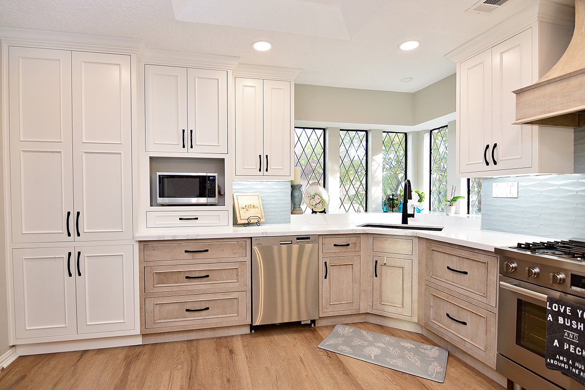 It's time for a home refresh and we can help you upgrade your living space from cold and dated to warm and welcoming.  <a href="/Showplace_Cab/">Showplace Cabinetry</a> Savannah door style Uppers: White paint Lowers: Maple | Montana stain