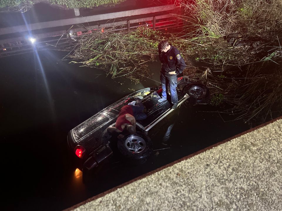 CHP_Stockton's tweet photo. Officers Brown and Lee rescued a DUI driver from a submerged vehicle in White Slough. Brown jumped in, broke the window with Lee's baton, and the driver was rescued. CHP reminds you...Do not drink and drive!
#StocktonCHP #CaliDDP #chpcareers #californiahighwaypatrol https://t.co/7bj74PVNsX