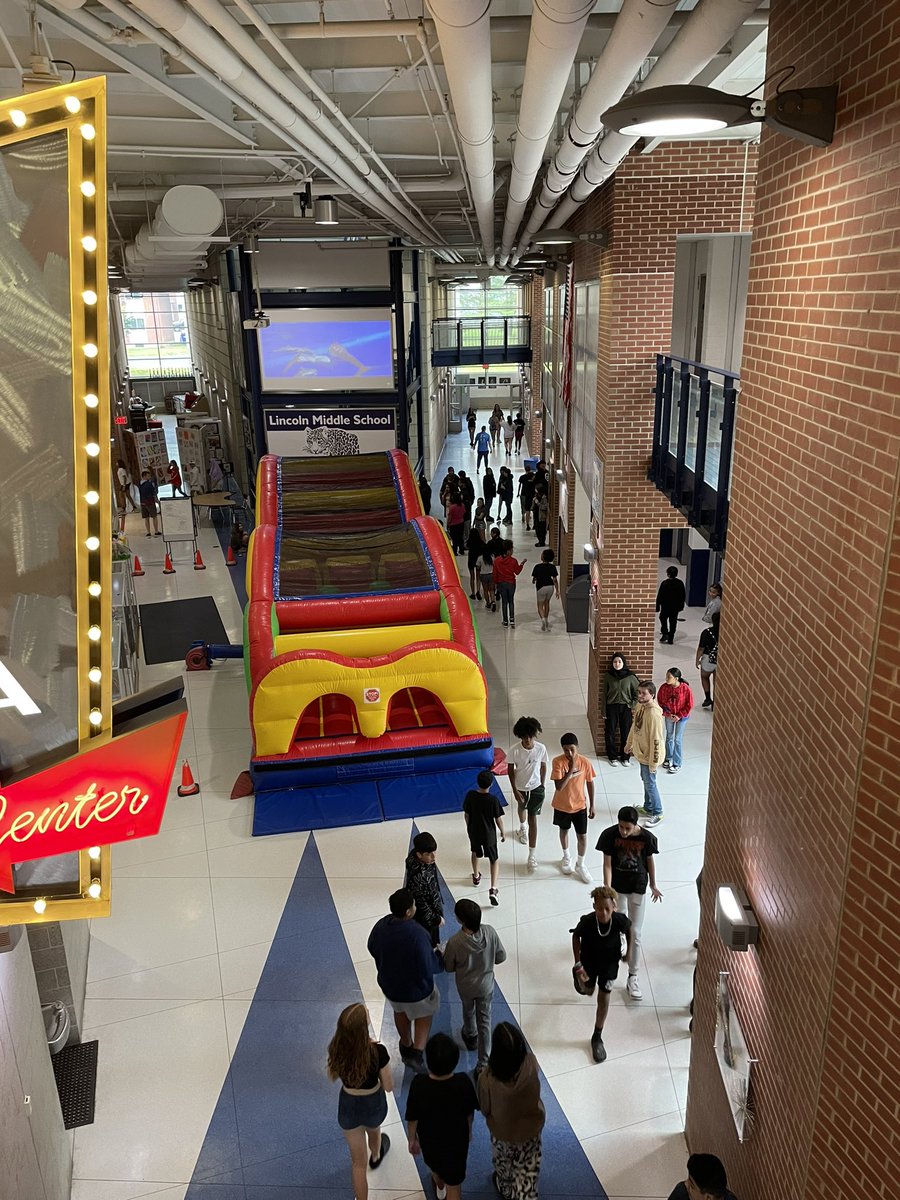HodumLMS's tweet photo. A little rain didn’t stop us from holding the most memorable field day ever! Complete with a bounce obstacle course in Times Square. Thanks @LJWask for taking the reins! And to all that competed in the teacher inflatable race. Reason 1001 why I love being a leopard. #brightspot https://t.co/CFubPn38JB