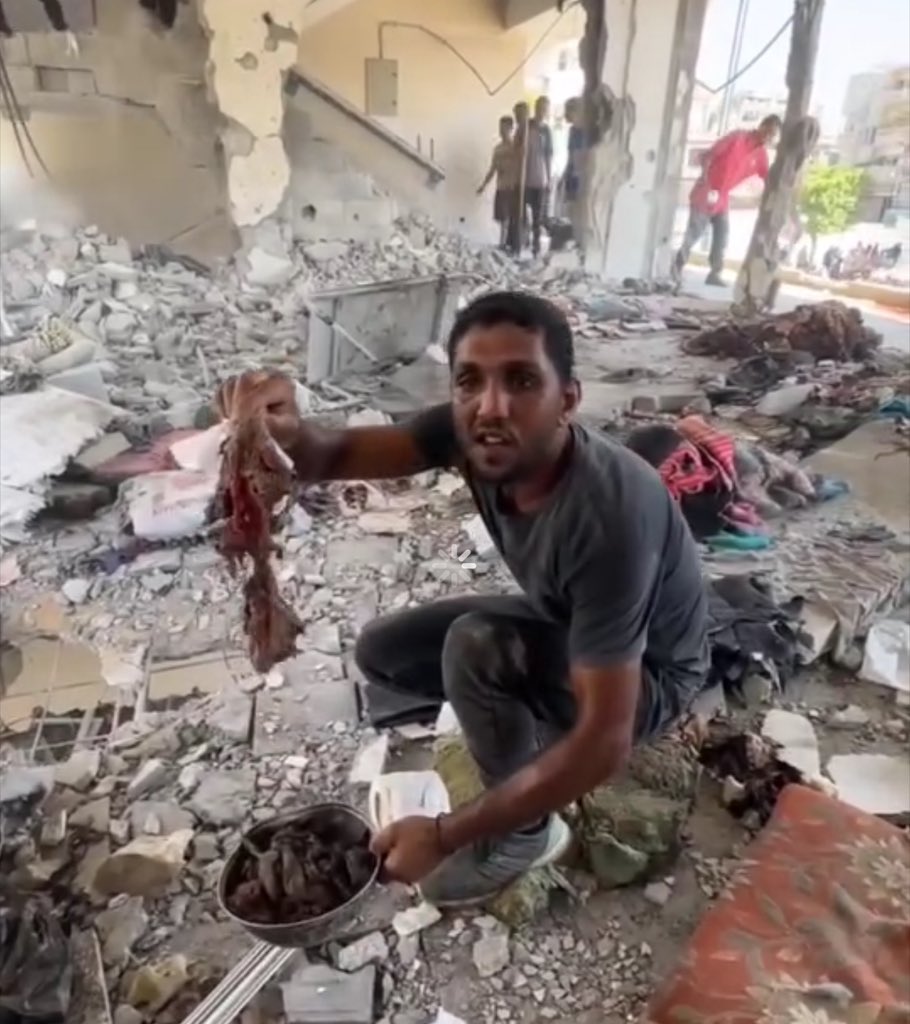 Astridueil's tweet photo. Gazans collect remains of body parts after massacres. A child's finger, skin, and remains of women and children killed in a school in Nuseirat refugee camp last night https://t.co/8oRntZNlP0