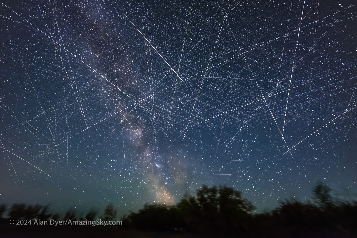 The satellite-strewn sky, in a stack of cumulative exposures taken over just 30 minutes on June 4/5, 2024 from latitude 51° N, looking south. The field is 100° by 75°. There's one natural streak, from a meteor, at center. The others are from what humans put there. <a href="/twanight/">TWAN</a>