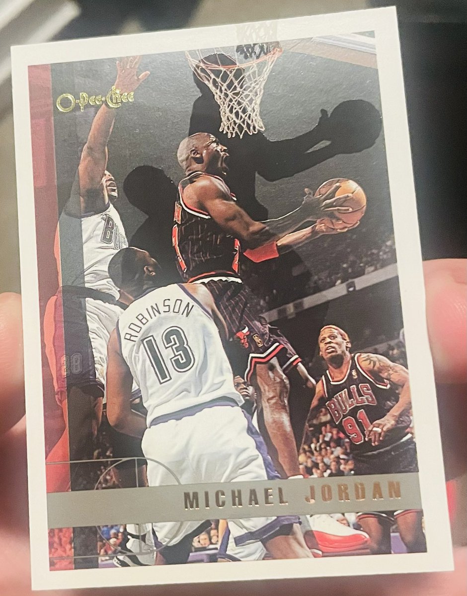 NathanHeady1's tweet photo. @CardPurchaser Found this Jordan O-Pee-Chee in a binder I bought. Seems to be a rare ssp already but also has shadows of Jordan and Robinson. The net also is reprinted on the top. Is this a printing error?! Does this make the card  even more rare? How could this affect value? https://t.co/G2hg7nI9CZ