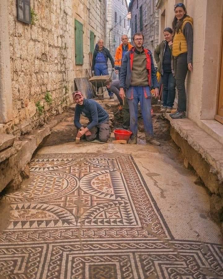 Old mosaic floor found under a street in Rome…..