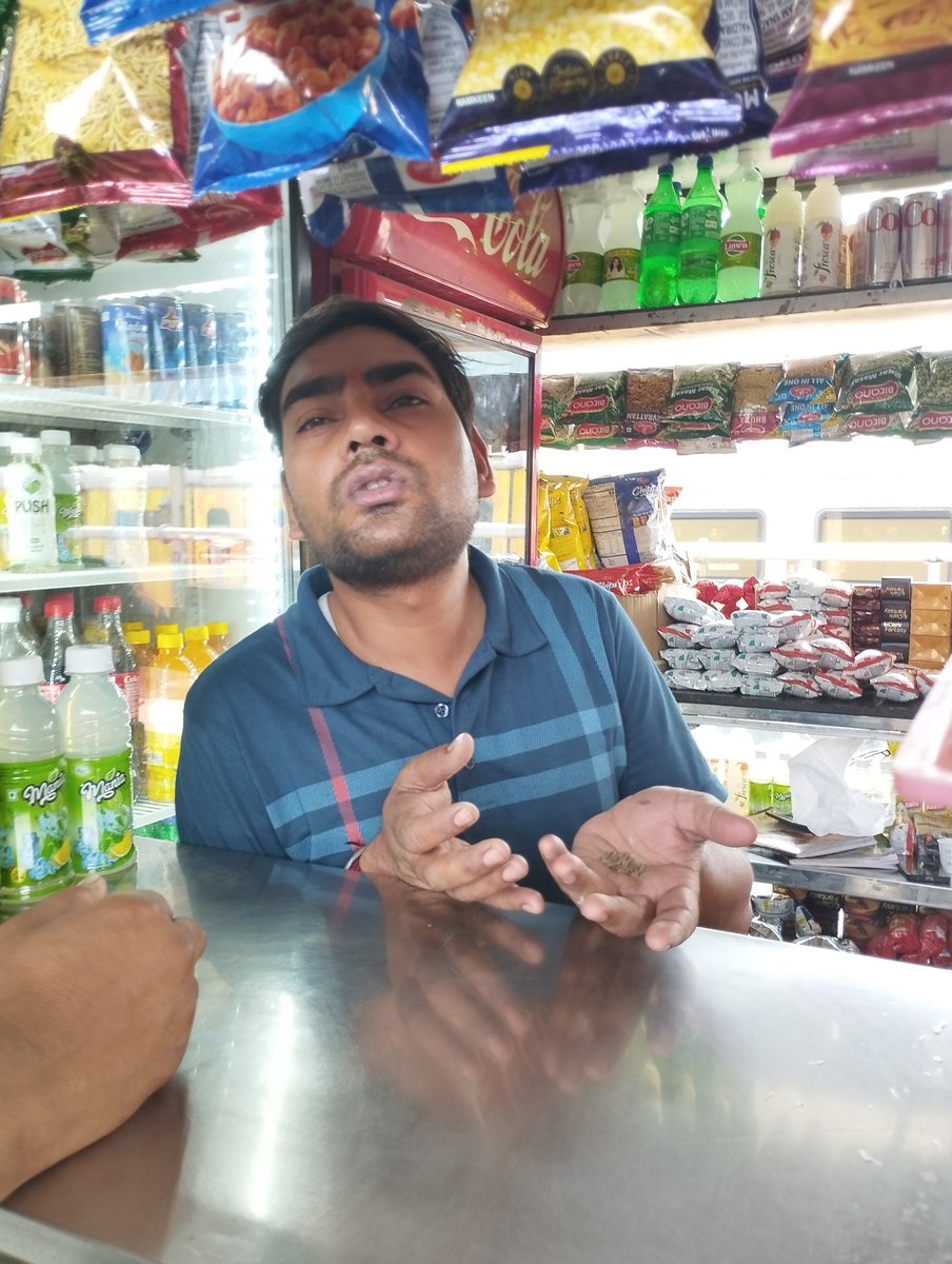 SongInHead2day's tweet photo. @RailMinIndia @RailwaySeva  At NDLS platform 11, this man is cheating foreigners, insisting that we pay Rs 10 over the MRP for official RailNeer water because "Cold price! Cold price!" Please do something that he not be allowed to cheat people anymore https://t.co/ghYdQ5rT5P