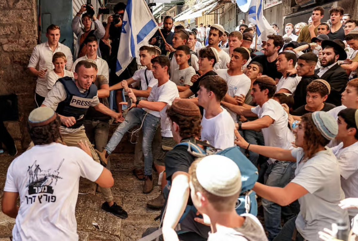 amasad's tweet photo. Every year Israelis go around Jerusalem hunting Palestinians to torture and abuse.

Think Spanish “running the bull” with all its cruelty but directed at humans.

This event is supported by their government and police (and of course US taxpayer).

The victim here was arrested. https://t.co/RpnV2NKGmC