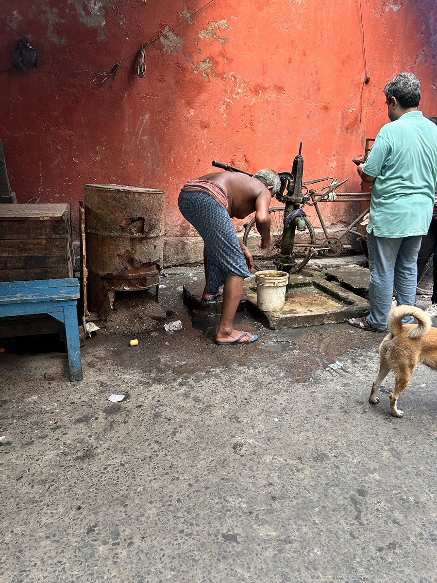 People have no option than to draw water from a tube-well next to a choked drain ! 
Scene from Dacres lane widely popular for food joints and hence utmost hygiene should be maintained.