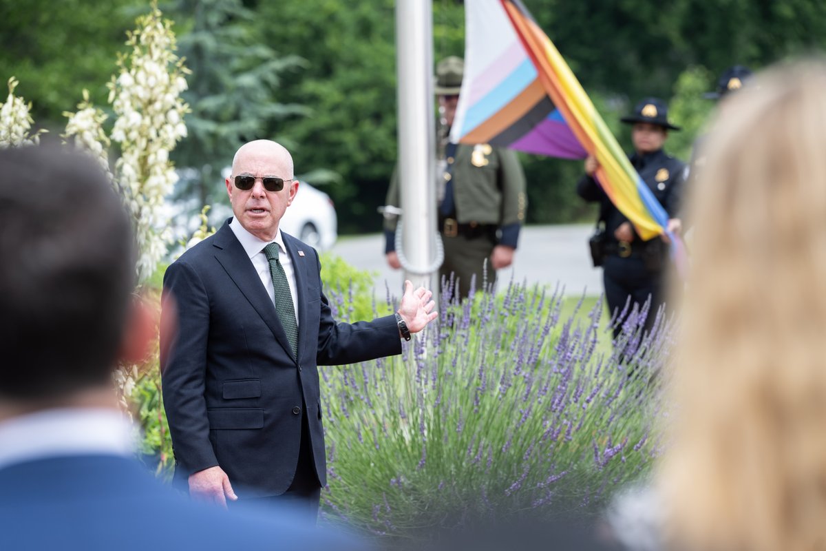 DHSgov's tweet photo. Pride month celebrates the LGBTQIA+ community and their contributions to our society and the #DHSMission. DHS hosted a Pride Flag Raising Ceremony as we rededicate ourselves to the pursuit of diversity, advocacy, authenticity, and equity for all. #LivingOurTruth https://t.co/cS50SzVEhX