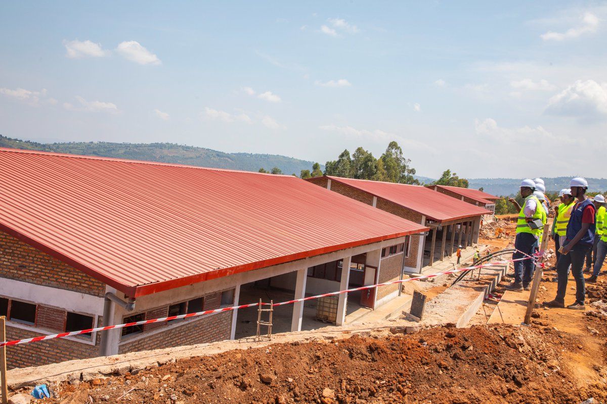 RwandaEmergency's tweet photo. Today, PS @P_Habinshuti and @NzabonimpaEmmy, Mayor of @GicumbiDistrict, visited ongoing construction works for Giti TVET School. The progress is at 87% &amp; set to accommodate around 500 students, and will offer courses in trades of Automobile Technology and Building Construction. https://t.co/70LrZE0VRV