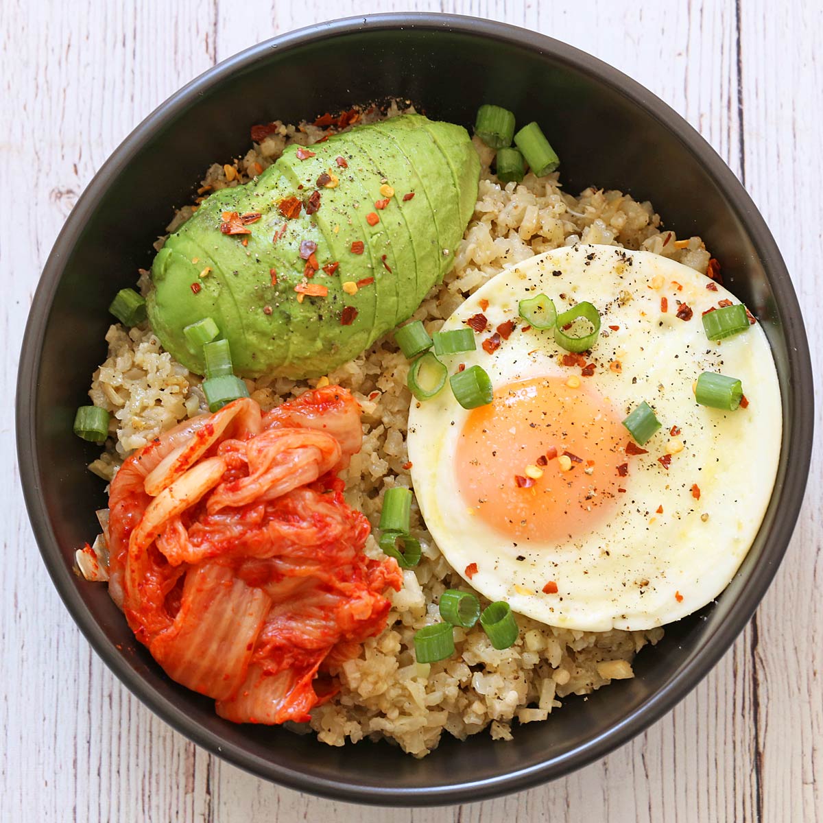 YummyHealth's tweet photo. Cauliflower rice is topped with a fried egg, avocado, and kimchi. One of my favorite #keto lunches! 
https://t.co/sixr6mmAfb https://t.co/KX3Ie9vvVG