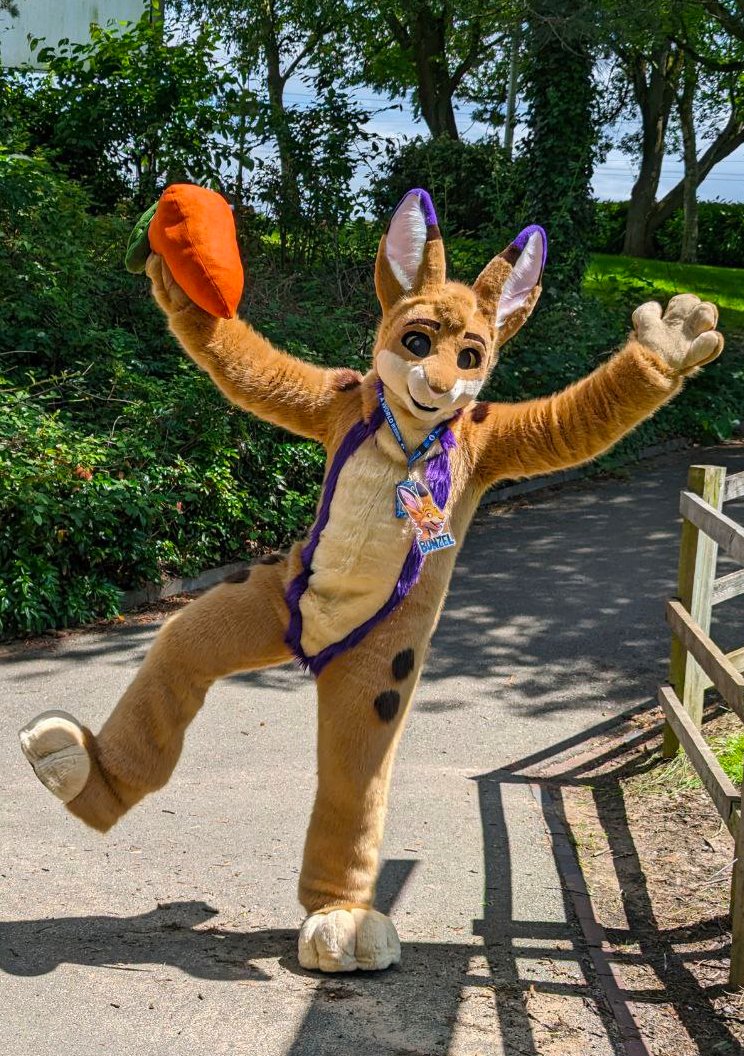 Bouncing around Confuzzled in the sun 💜 #FursuitFriday