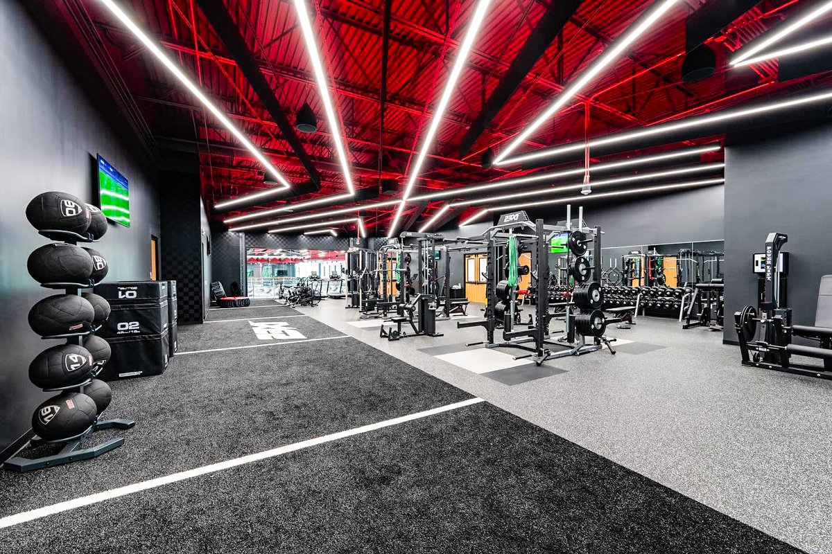 FOS's tweet photo. A look inside Airspeed—the new North Carolina HQ for Michael Jordan and Denny Hamlin’s 23XI Racing:

• 114,000 sq. ft.
• Weight room, sauna
• MJ and Hamlin memorabilia
• Windows with a 23-degree tilt
• Conference room with 45 pairs of Jordans https://t.co/Ec1lqECF5V