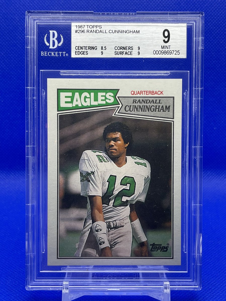 atc2448's tweet photo. @JunkWaxHeroes The card I bought as a kid, graded a few years back, and the poster that was on my bedroom wall. #RandallCunningham https://t.co/3KsZNyyYQt