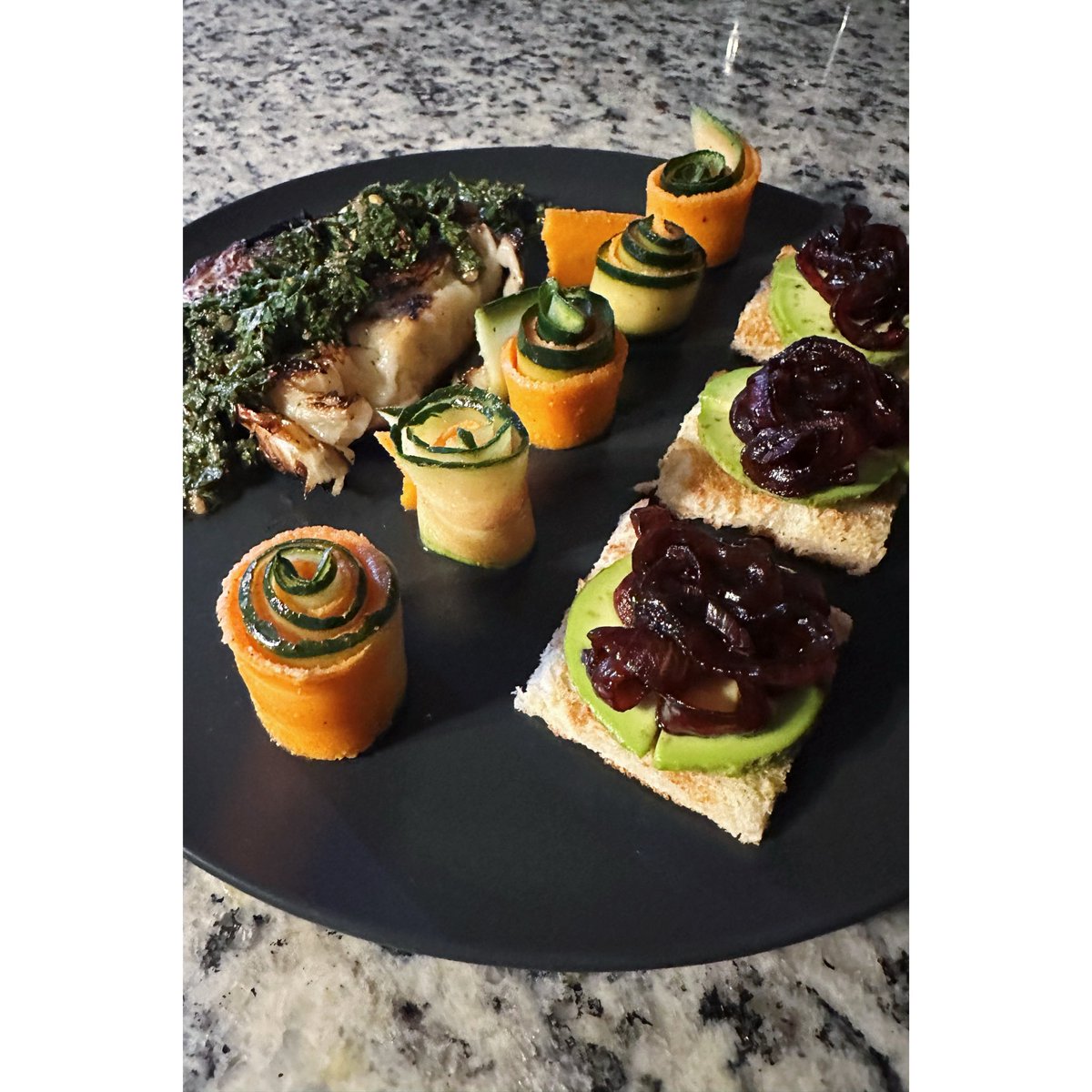 CreativeGiles's tweet image. Pan-seared and roasted marinated cabbage steak topped with a carrot-top-chimichurri, rolled up ribbons of mustard vinaigrette marinated carrot and lemon oil marinated cucumber ribbons with a side of sourdough toast topped with avocado and balsamic vinegar caramelized red onions.