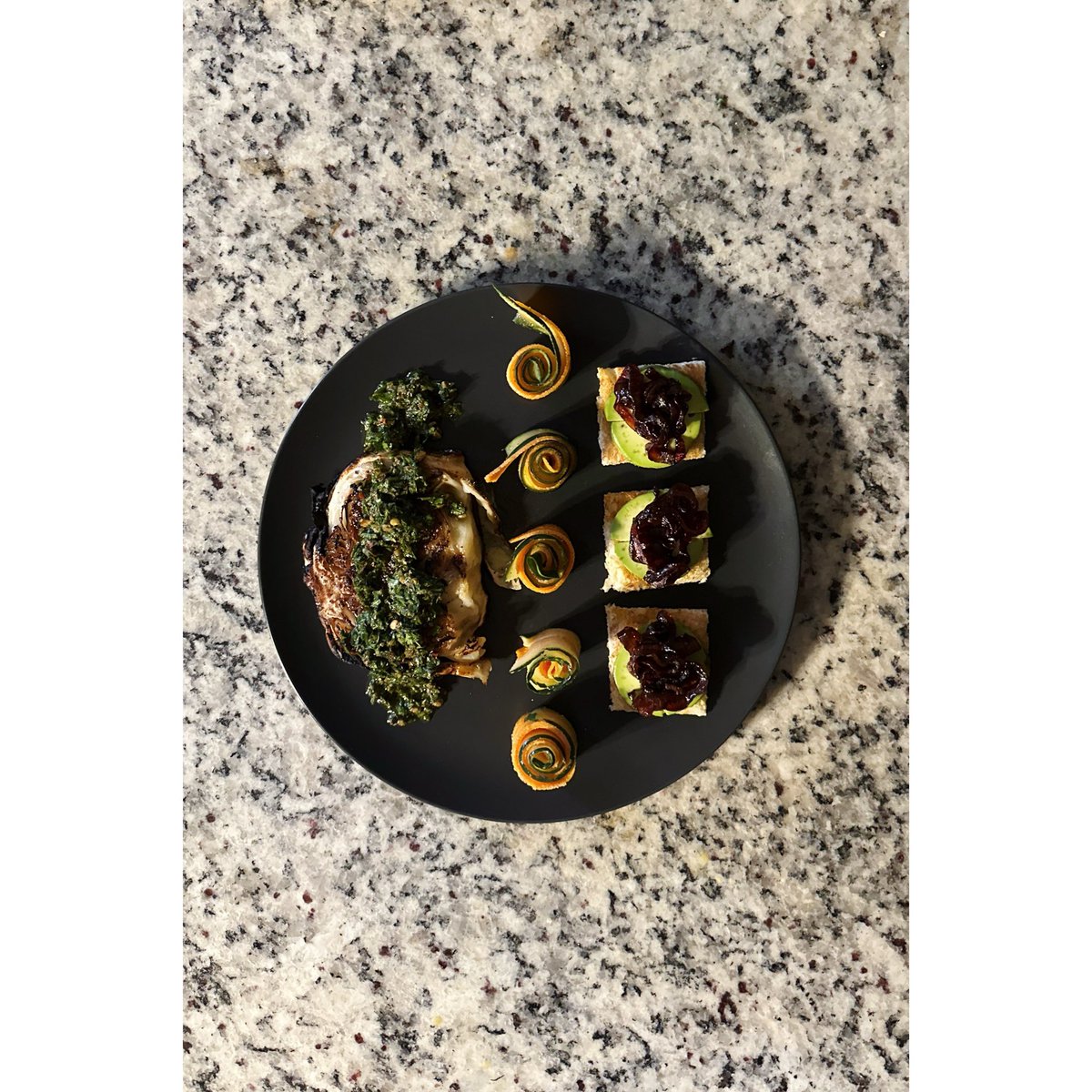 CreativeGiles's tweet image. Pan-seared and roasted marinated cabbage steak topped with a carrot-top-chimichurri, rolled up ribbons of mustard vinaigrette marinated carrot and lemon oil marinated cucumber ribbons with a side of sourdough toast topped with avocado and balsamic vinegar caramelized red onions.