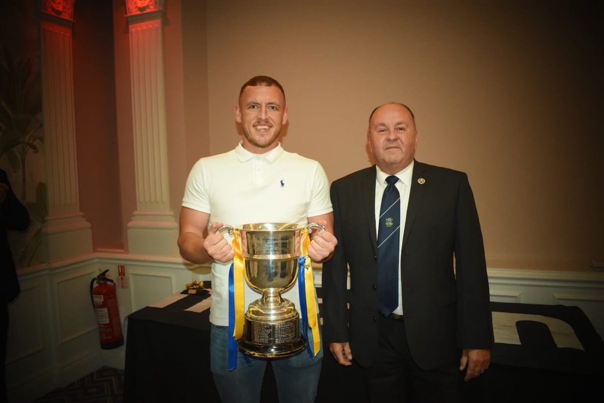 Penlan AFC Captain Luke Edwards receives the West Wales Intermediate Cup Trophy from new WWFA Chairman Wyn Davies at last night’s Presentation Dinner at the Diplomat Hotel in Llanelli