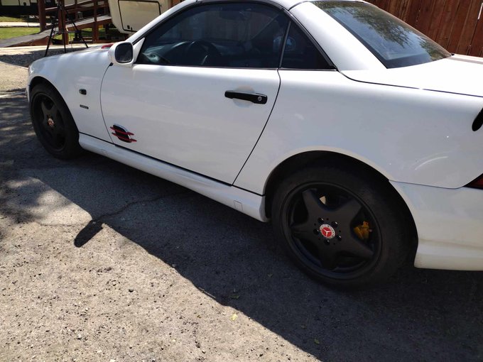 I painted my wheels with black Plasti-Dip today and put new classic red center caps on them. Turned out