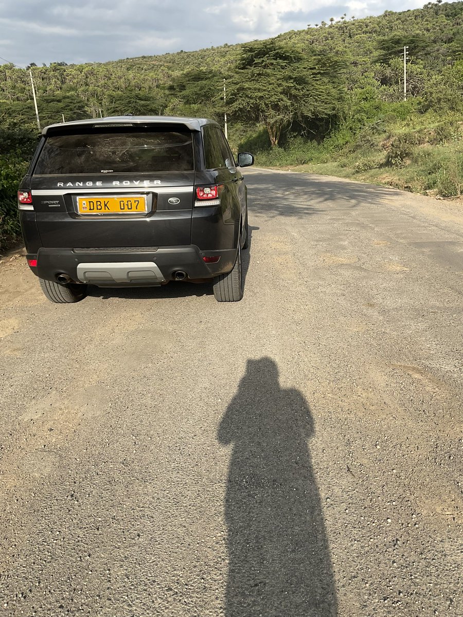 DonaldBKipkorir's tweet photo. Naivasha was once a vibrant upscale tourist destination with amazing lodges, camps & hotels … Then came flower farms making Billions in exports but paying peanuts to its slave-like employees. Because of thousands of underpaid flower employees, Naivasha became one big slum city. Then the flower farms collapsed leaving the farms eerily ghostly. Naivasha can now only go back to tourism to survive, yet the only main road, Moi South Lake Road that serves the tourists is in shambles. Annually, @KeRRA_Ke spends Millions if not billions in recarpeting it. It was only three years ago when KeRRA “fully rehabilitated” the road. When I drove on it yesterday, you can see that the tarmac was less than ONE INCH which little rains happily wash it away. When whole Management & Road Engineers of road State Corporations in Kenya be held to account? How do we allow them to be Billionaires whilst they give us ONE INCH TARMAC ROADS? The road looks more of a moon surface than what is claimed to be.