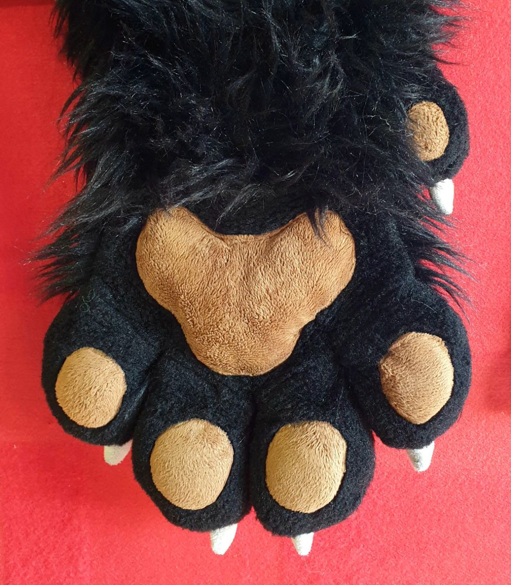cfconvention's tweet image. We'd like to reunite lost property from the fursuit lounges with their owners:

* 1 handpaw, black with brown pads
* 1 pair of handpaws, black and white with pink pads
* A brown eyelid
* A ducky collar

Get in contact and we can send you your missing parts!