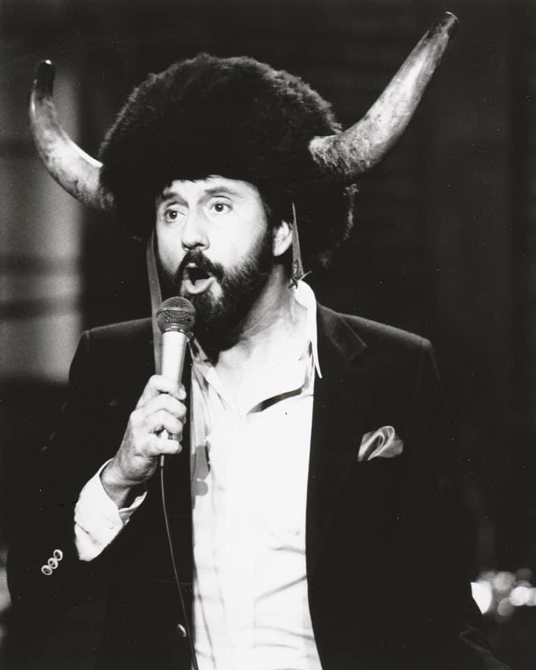 RayStevensMusic's tweet photo. #SillySunday Haha! Check out Ray in his amazing hat while performing “Erik The Awful” live at the Mercy Lounge in Nashville, TN in 1984 for a TV show called "Country Now"!
#hornedhat #horns #amazinghat #sillyhat #funnyhat #blackandwhitepic #coolhat #iwantthathat #buffalohat https://t.co/1OccEOLTGx