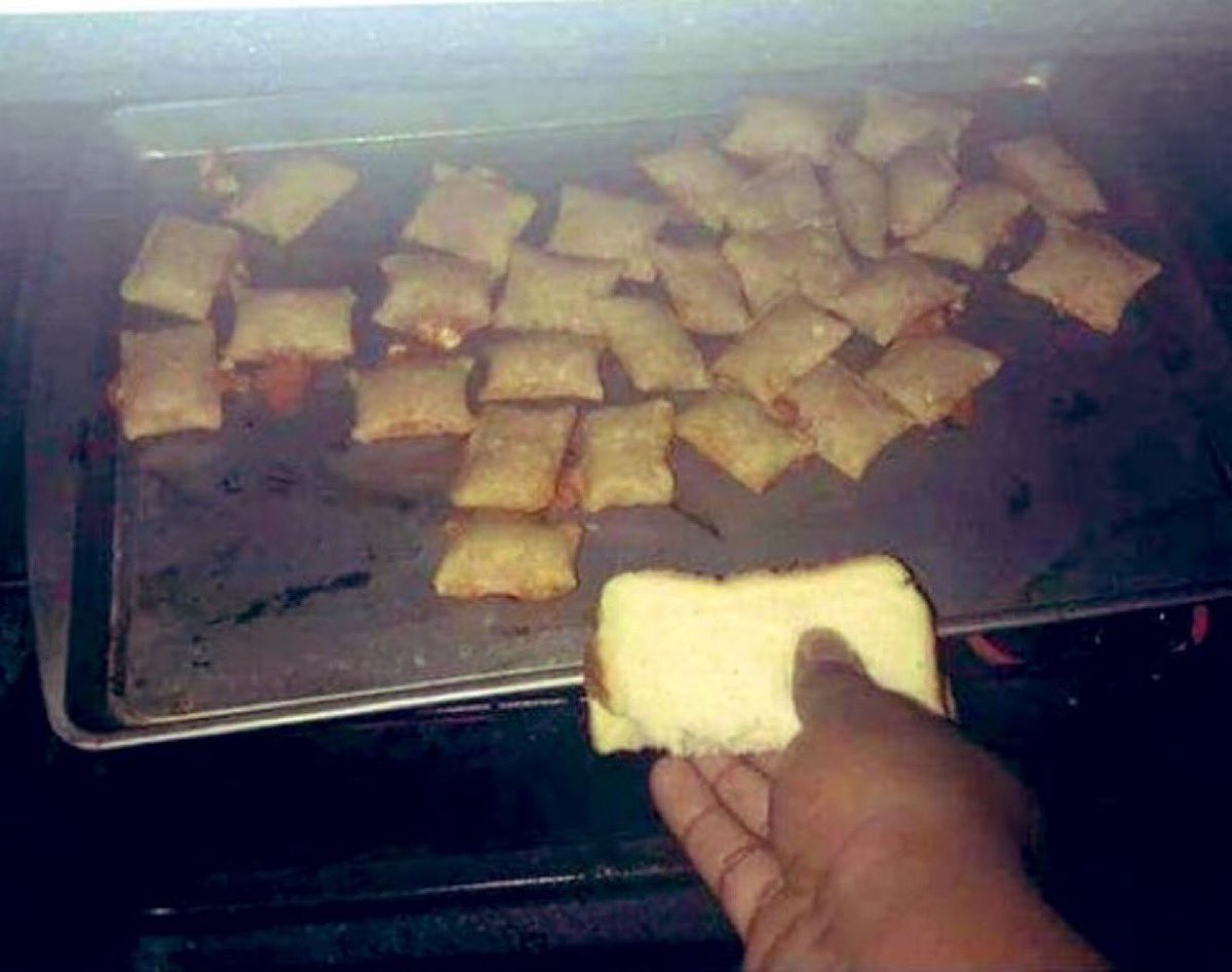 Nothing says “Not bouncing back from the divorce just yet” quite like using a folded slice of bread as an oven mitt …